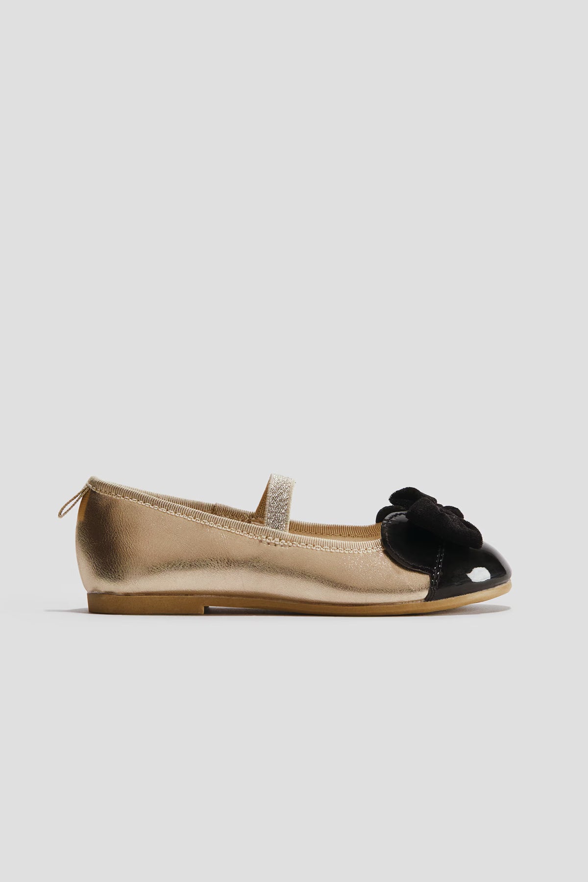 Flats Doradas con negro minnie h&m