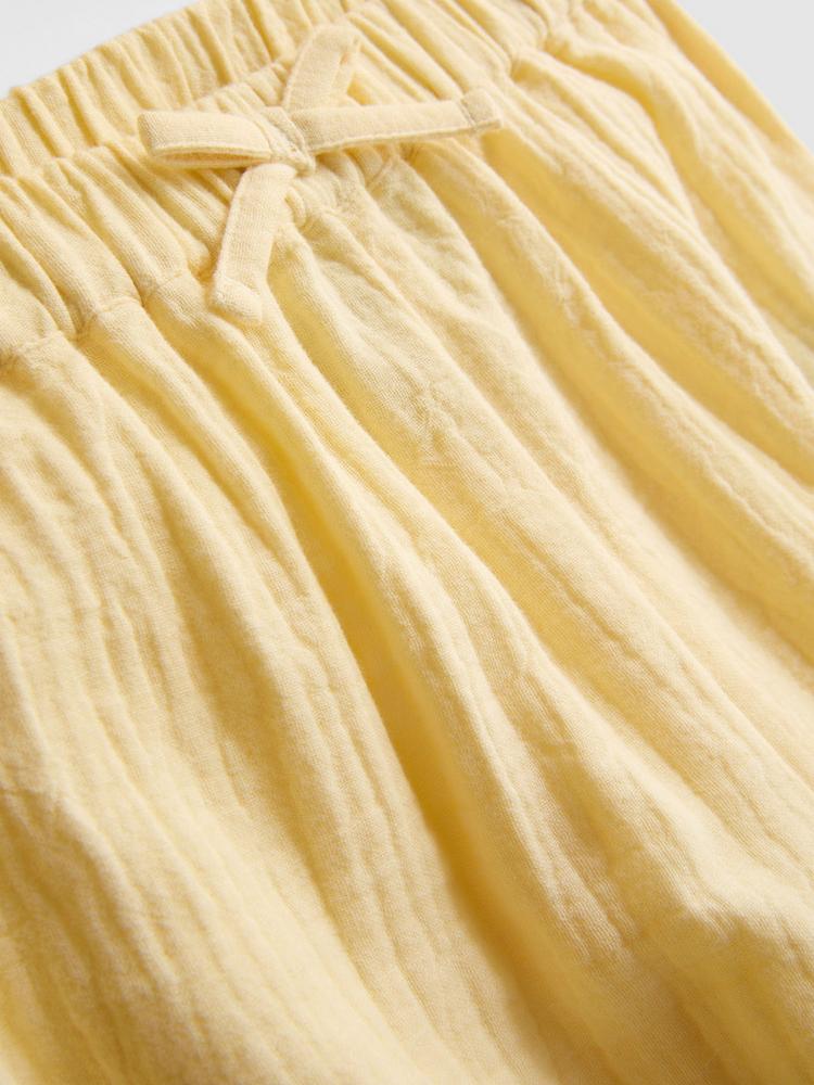 CONJUNTO AMARILLO DE BLUSA SIN MANGAS Y PANTALÓN
