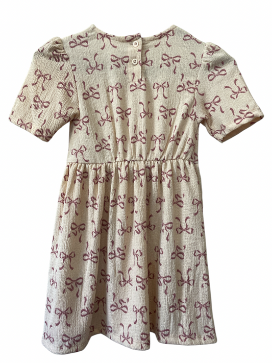 Vestido Beige Con Moños Rosados