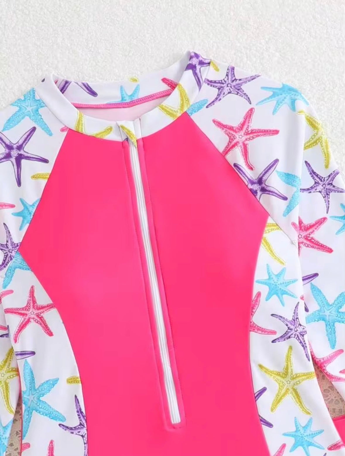TRAJE DE BAÑO ROSA CON ESTRELLAS DE MAR